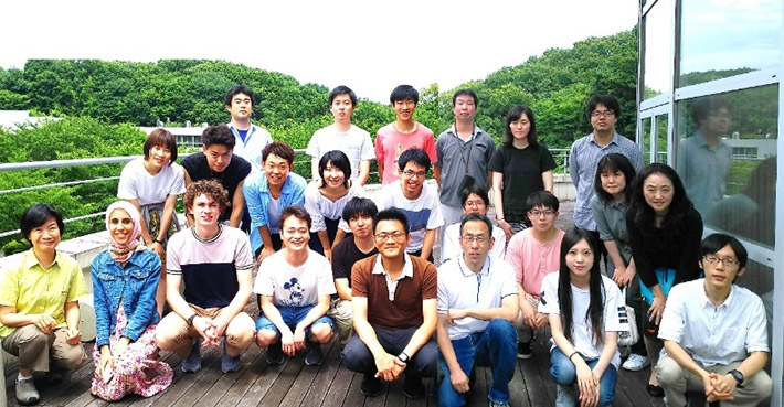 Cooper (front, third from left) with Kume lab members