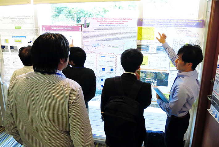 Mr. Kota Nabeya presenting his poster (right-hand side).