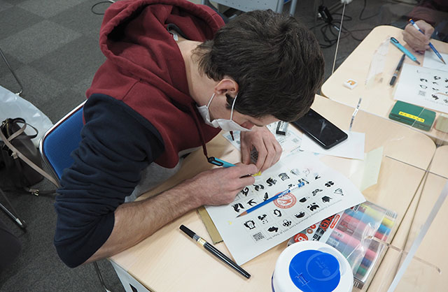 Participants creating his eraser stamp
