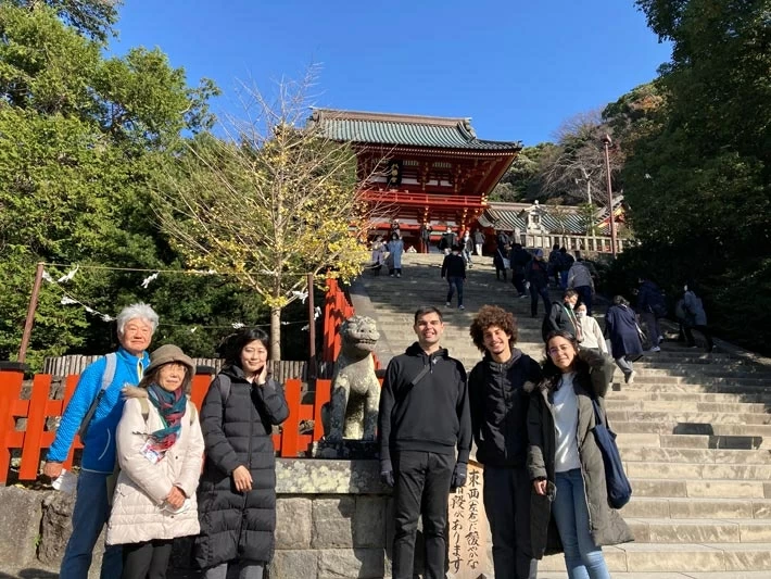Students and guides in front of main shrine at Tsuruoka Hachimangu