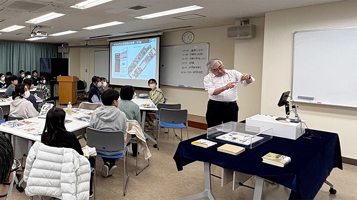 Shinozaki demonstrating industrial applications of ferrite during his lecture